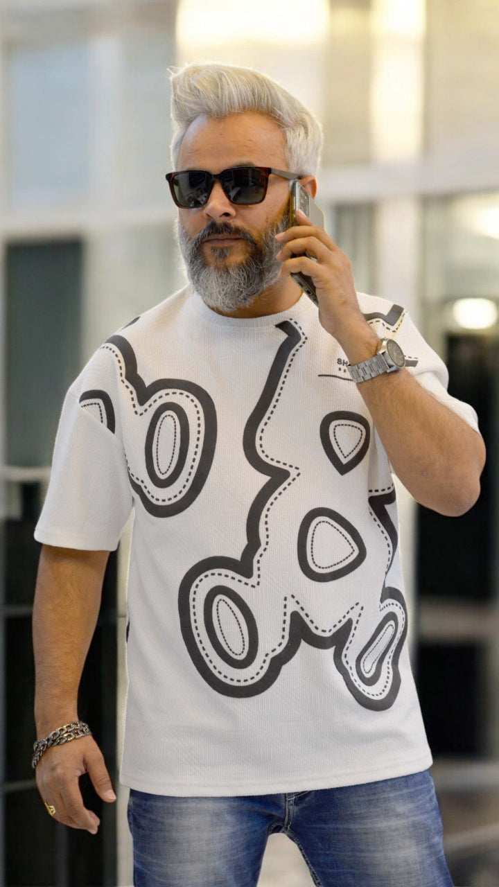 Front View: "White oversized T-shirt for men – Jacquard fabric, puff print, and drop-shoulder fit"