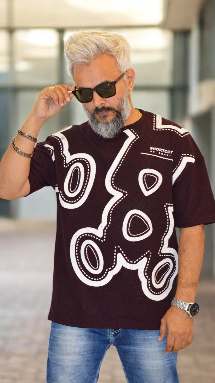 Front View: "Black oversized T-shirt for men in Jacquard fabric with puff print – Streetwear fashion"
 