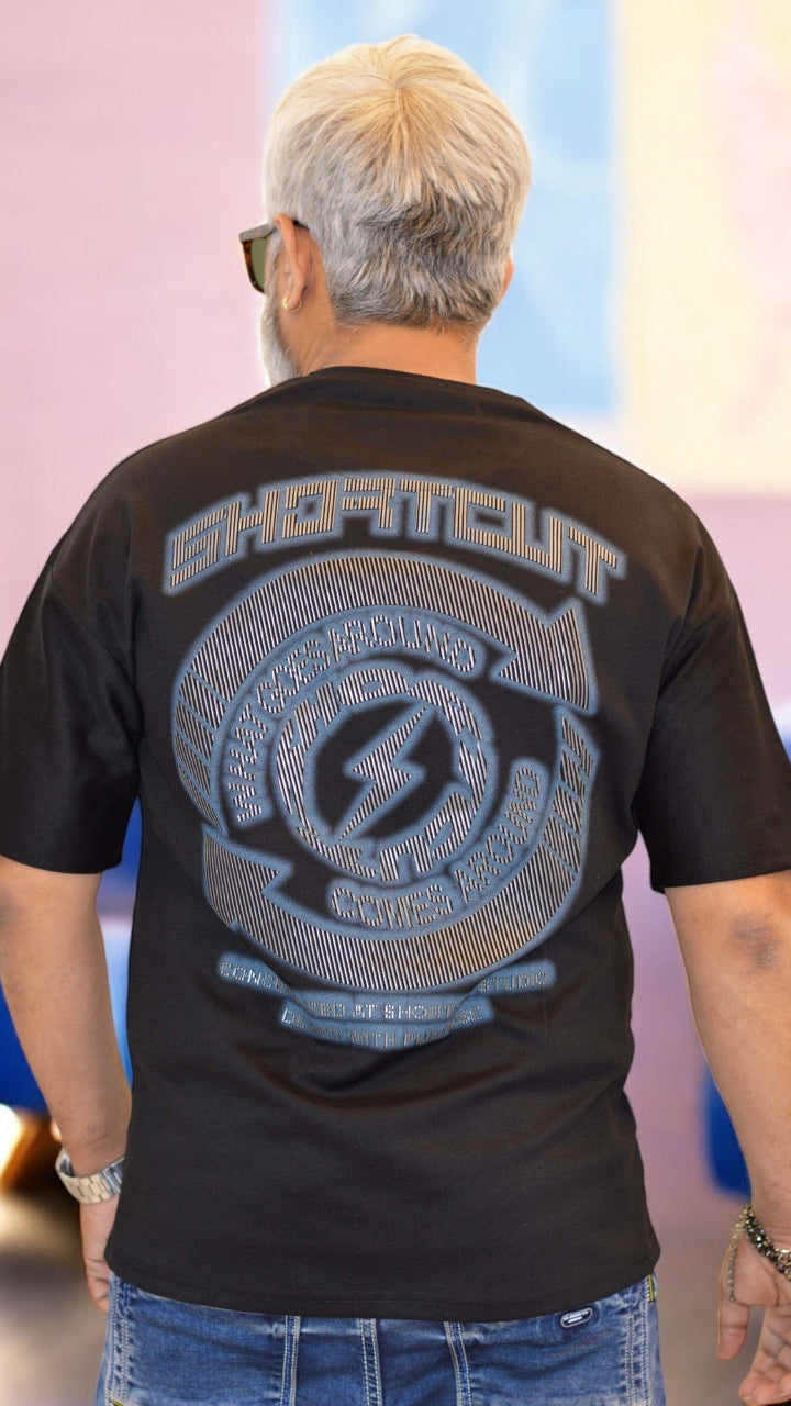 Back View: "Back view of black oversized T-shirt – Trendy drop-shoulder fit with bold HD printing"
