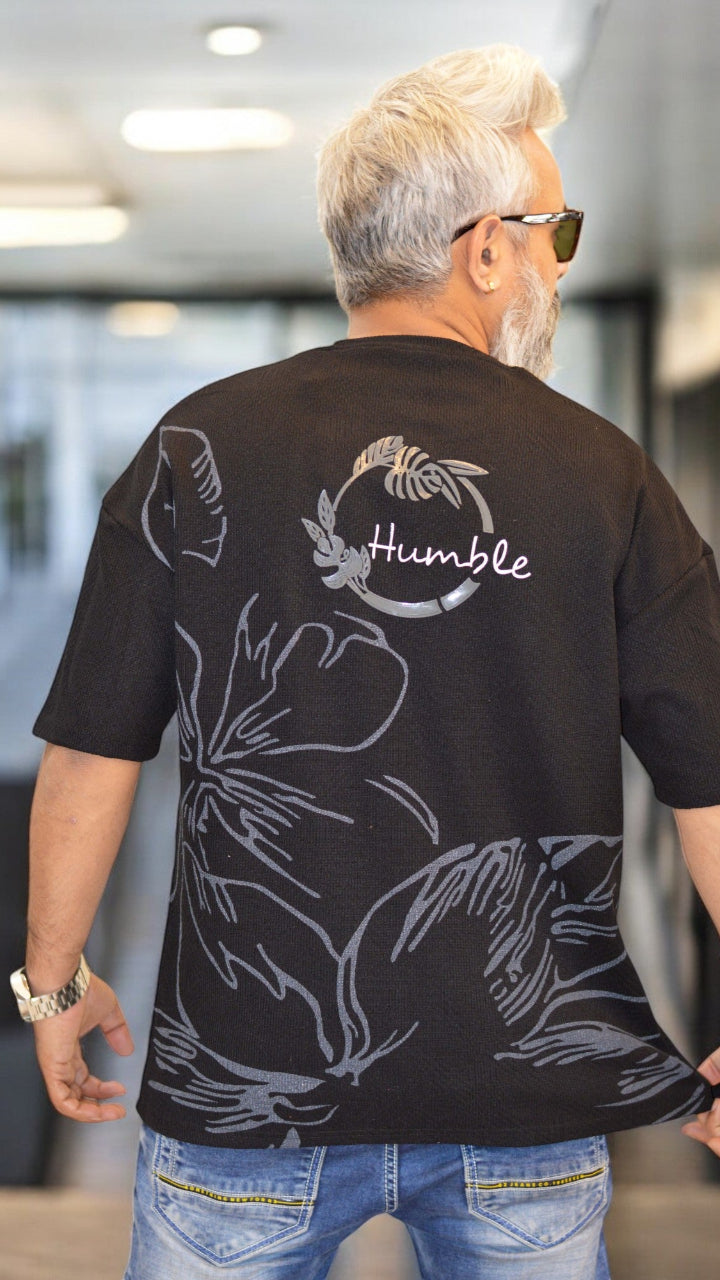 Back View: "Back view of black oversized drop-shoulder T-shirt – Premium streetwear fashion"
