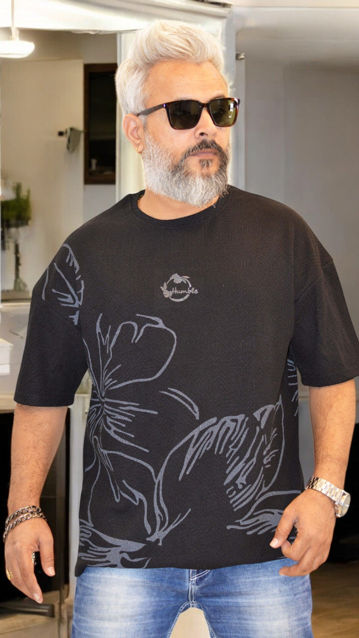 Front View: "Black oversized T-shirt for men – Jacquard fabric with all-over print and silicone-embossed 'Humble' design"