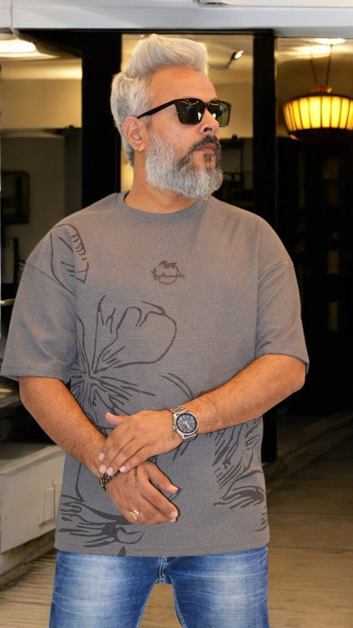 Side View: "Side profile of grey oversized T-shirt – Relaxed fit, imported fabric, and stylish embossed design"