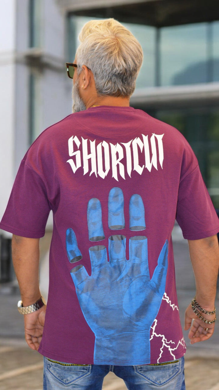 Back View: "Back view of dark purple oversized drop-shoulder T-shirt – Trendy streetwear fashion"