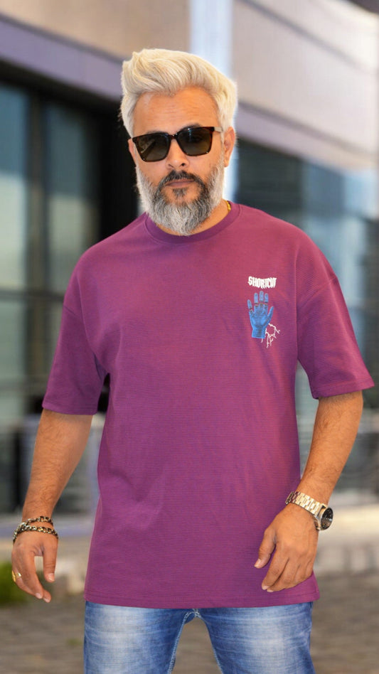 Front View: "Dark purple oversized T-shirt for men – Textured fabric with bold puff print design"